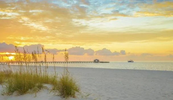 Gulf Coast beach at sunset — wellness and serenity